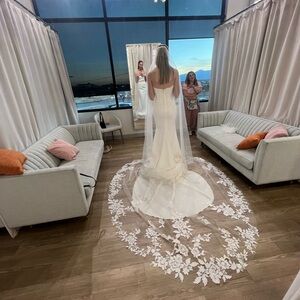 Elegant White Wedding Dress with Floral Lace Train